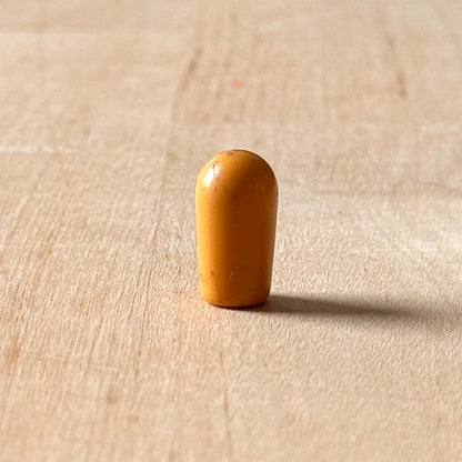 Vintage Kippschalterkappe in Bernstein